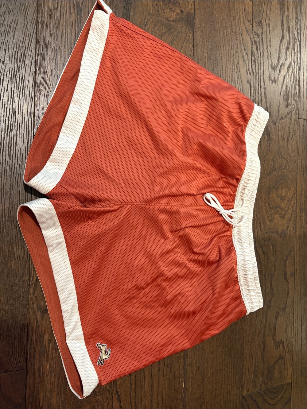 Tracksmith Orange Athletic Mesh Shorts with White Trim